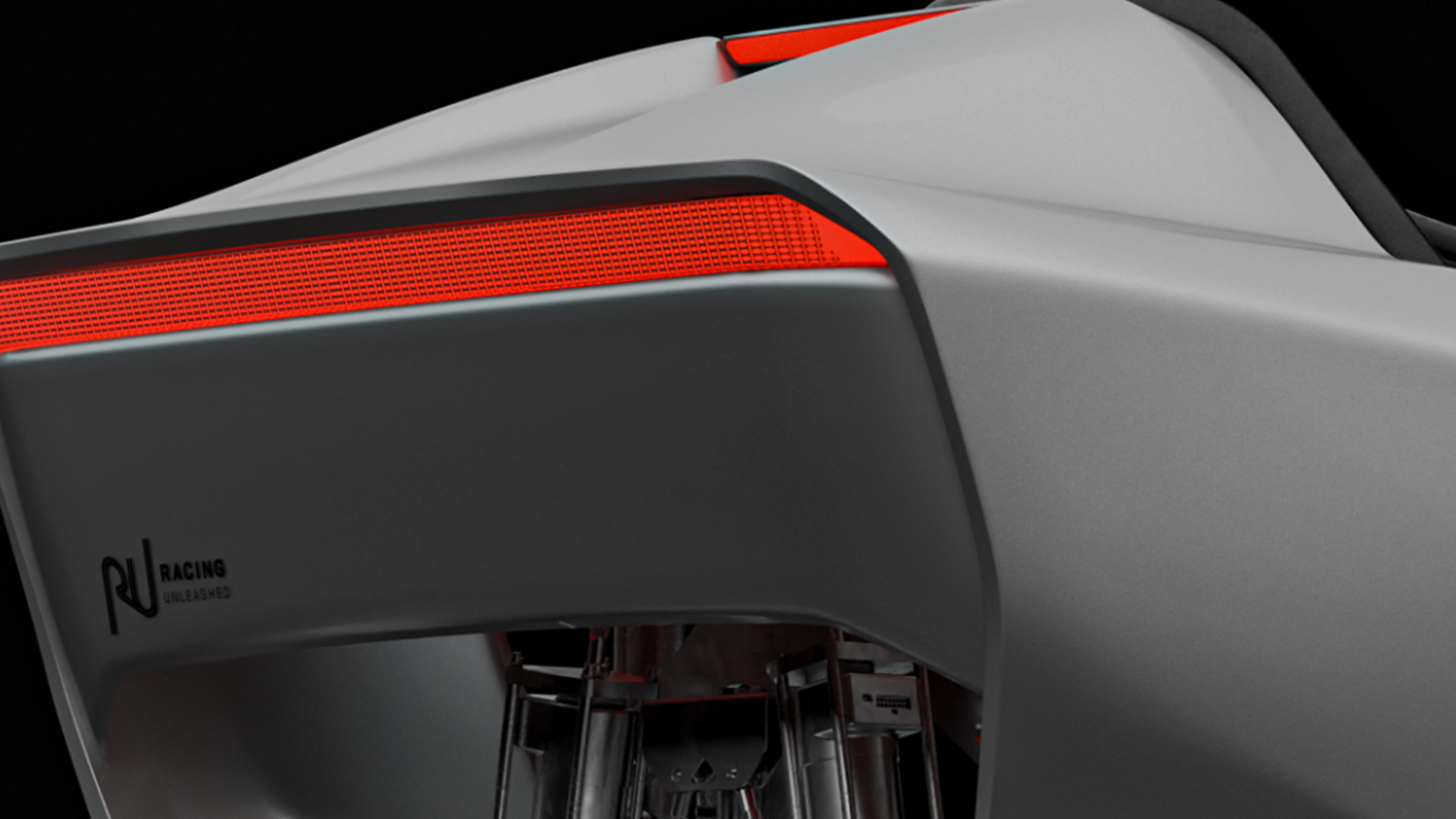 Grauer Rennsimulator von Racing Unleashed mit rotem Detail, modern und futuristisch gestaltet.