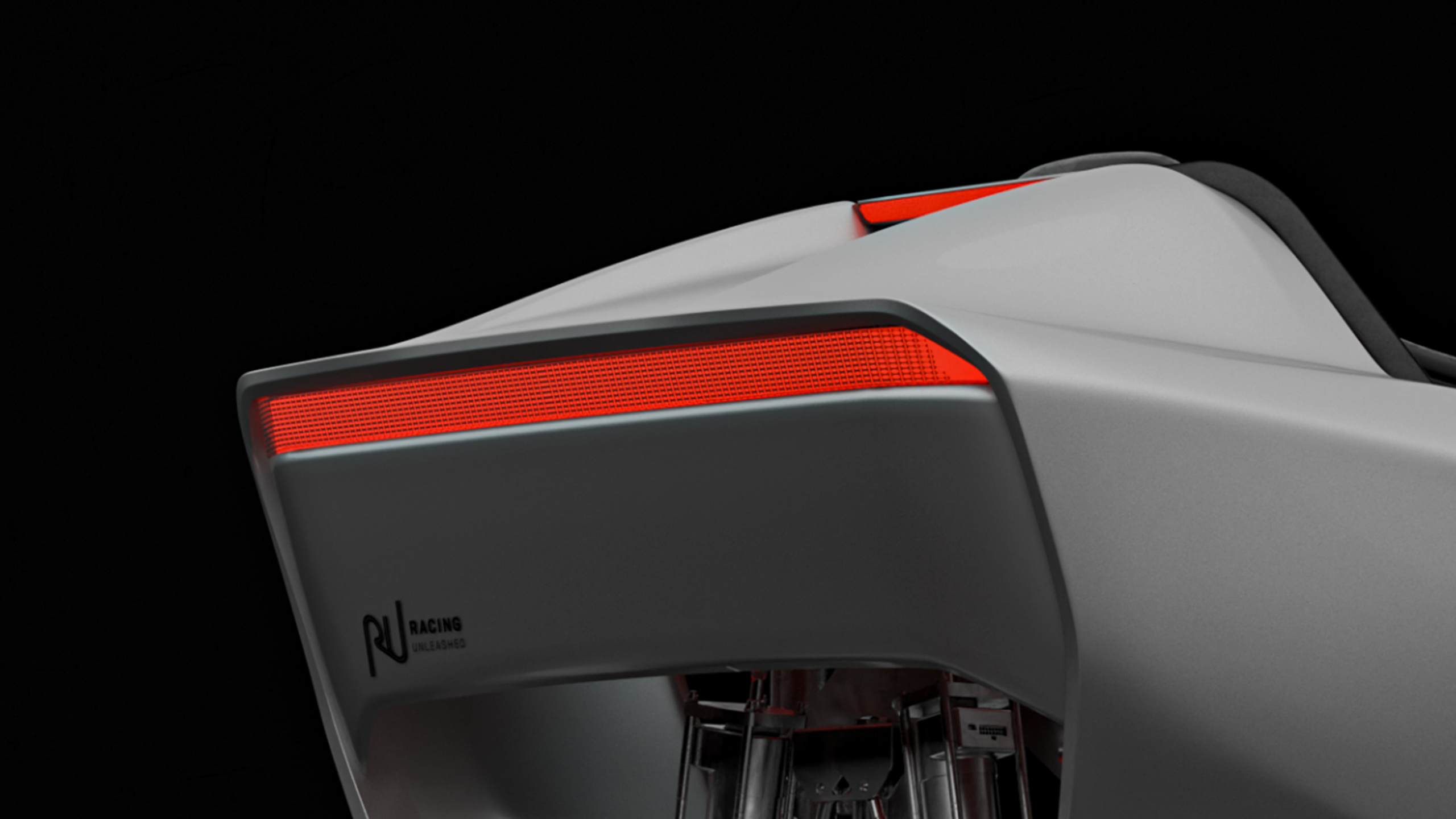 Grauer Rennsimulator von Racing Unleashed mit rotem LED-Licht, modernem Design.